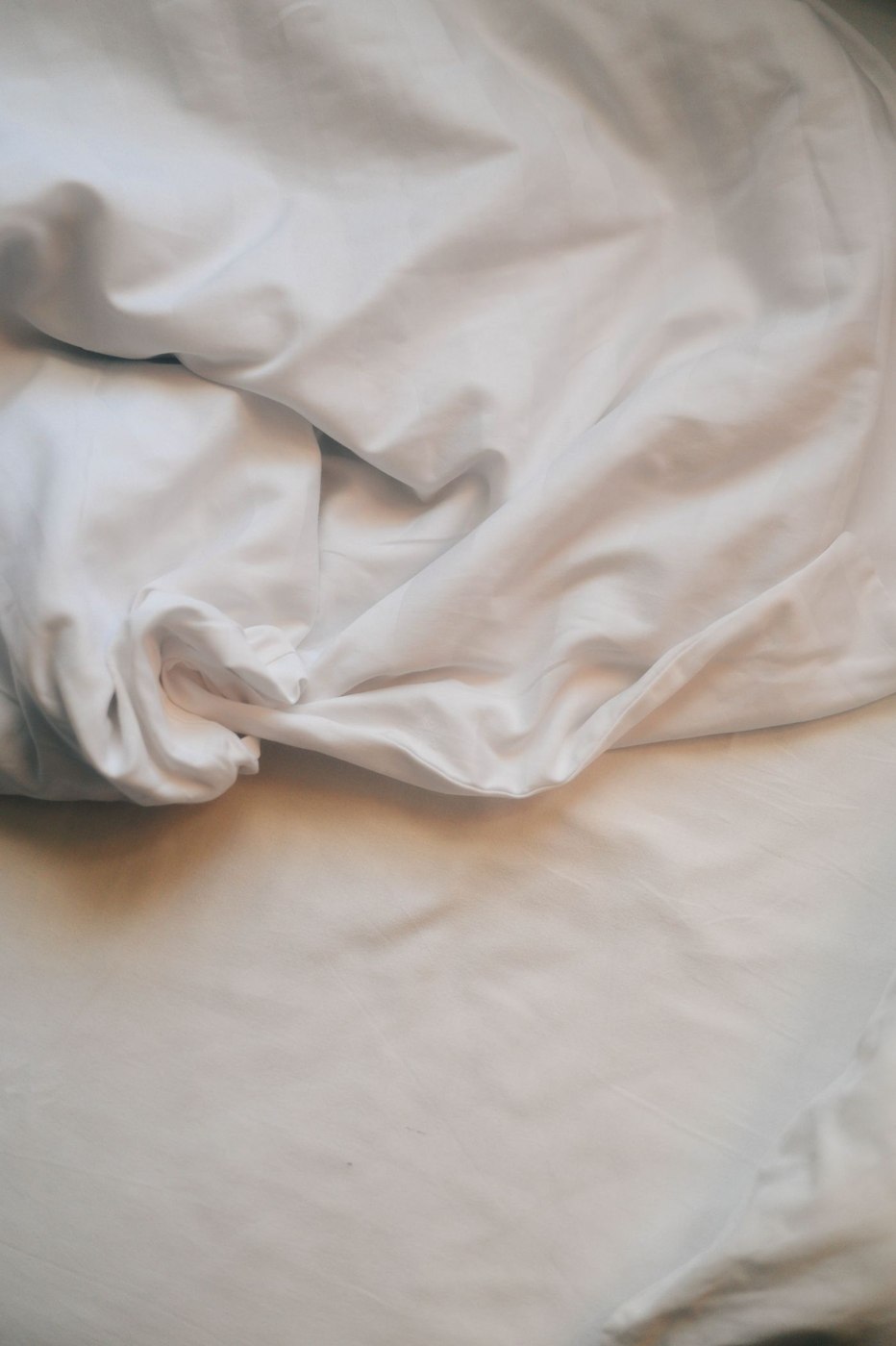 Relaxing White Linen Sheets in Soft Light