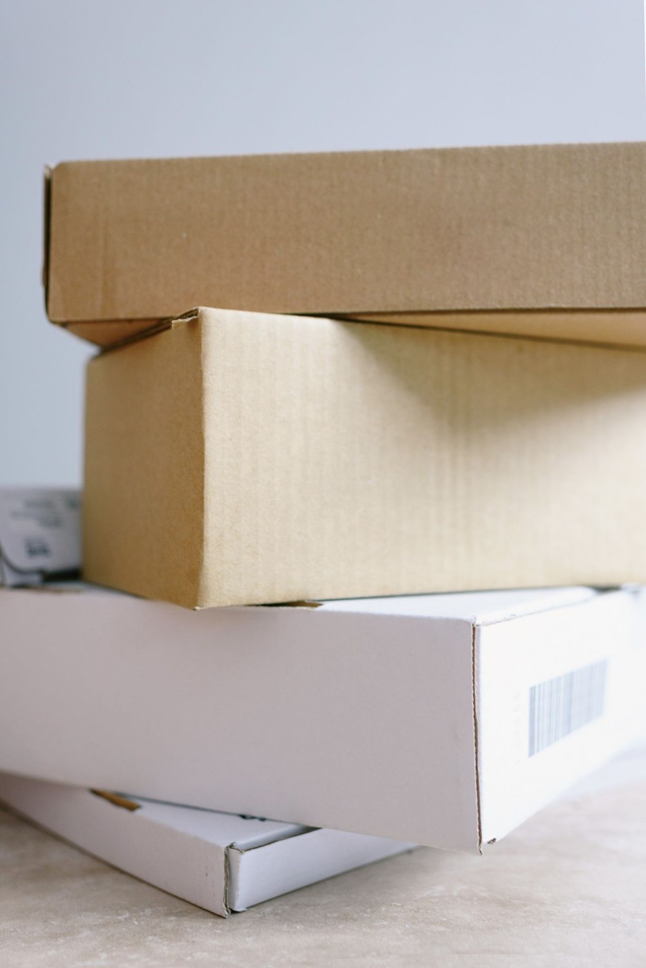 Stack of carton boxes on table