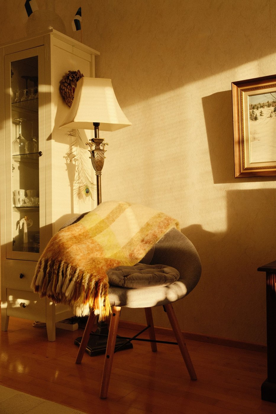 Cozy Interior with Chair and Blanket in Sunlight