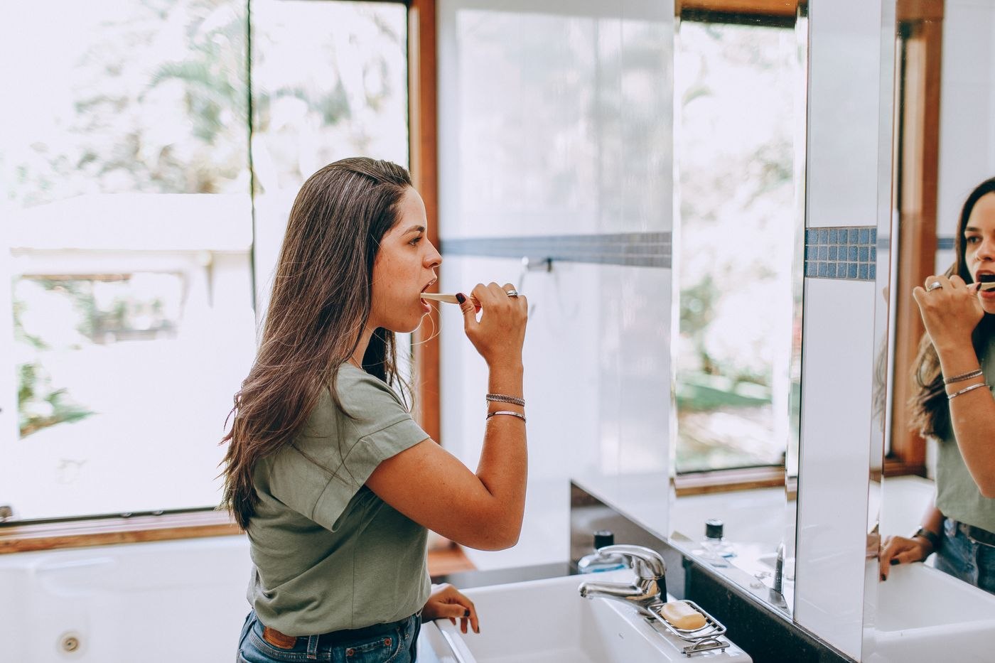 Brunette Woman Brushing Teeth