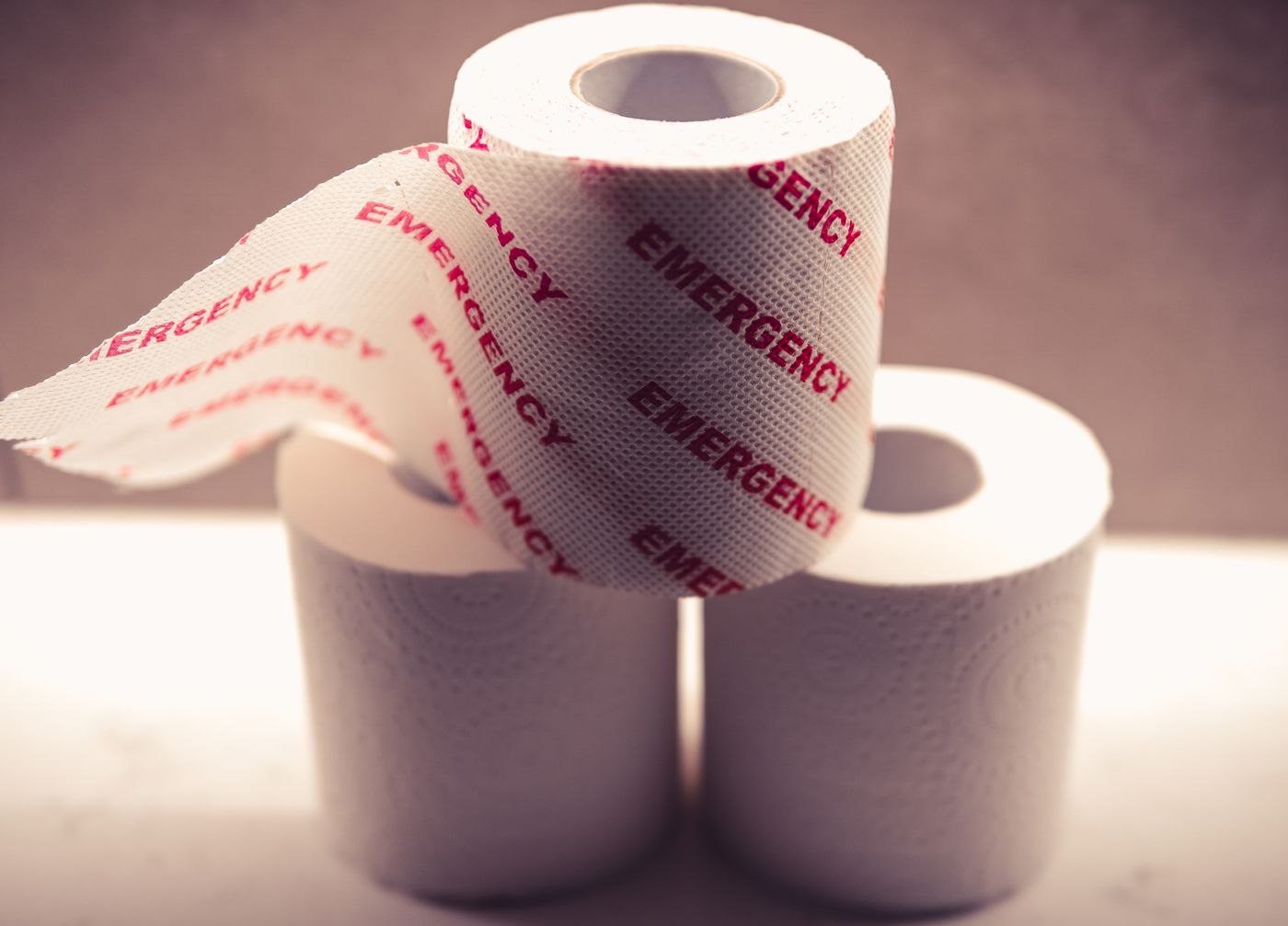White Toilet Paper Roll on White Surface