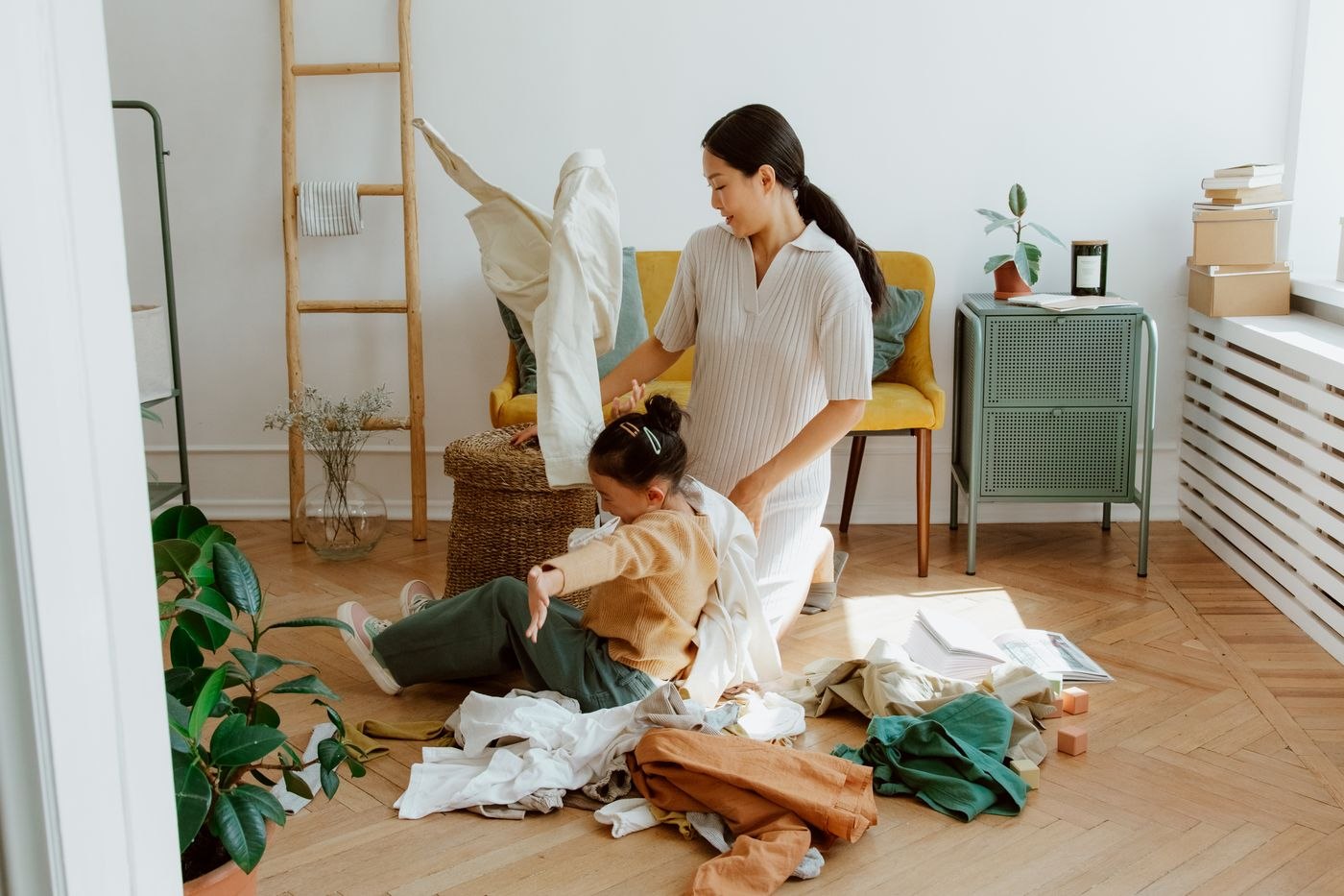 Mother and Daughter Folding Laundry